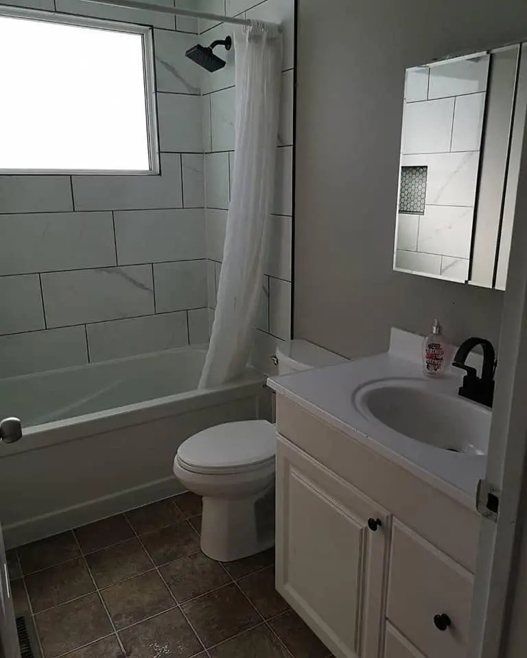 Bathroom renovation with a tiled tub surround
